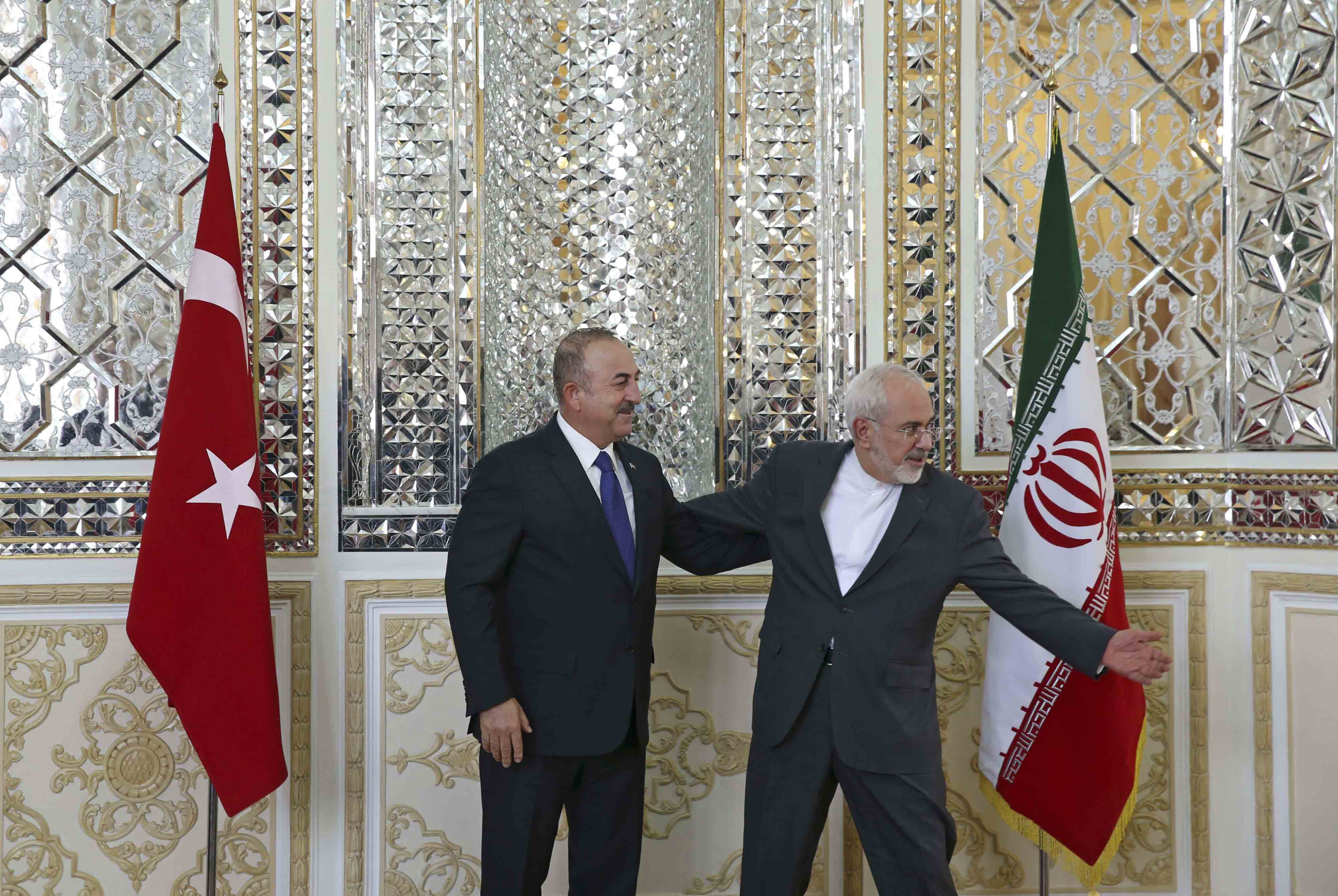Iranian FM with Turkish counterpart in Tehran, last February