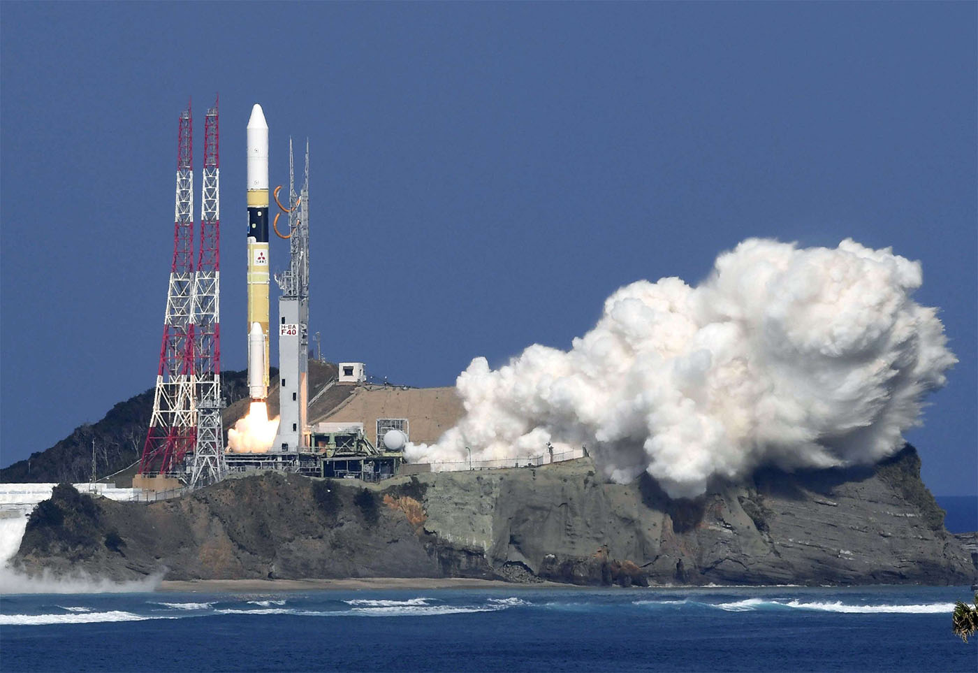 H-2A rocket lifts off as it carries an Ibuki-2 greenhouse gases observing satellite and KhalifaSat earth obervation satellite