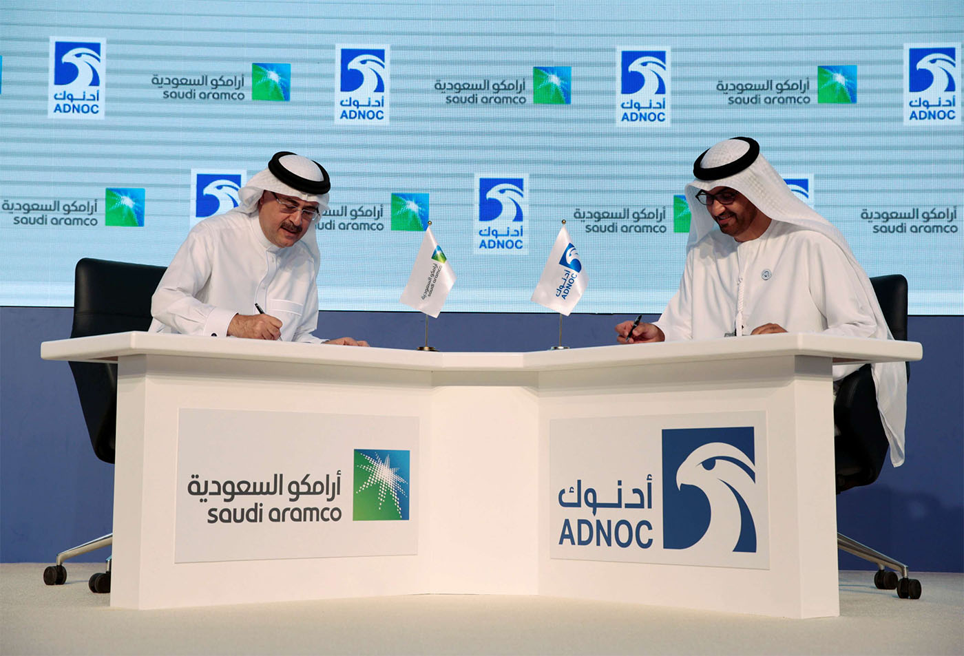 Saudi ARAMCO President and Chief Executive Amin H. Nasser (L) and Sultan Ahmed Al Jaber, UAE Minister of State and the Abu Dhabi National Oil Company (ADNOC Group) CEO