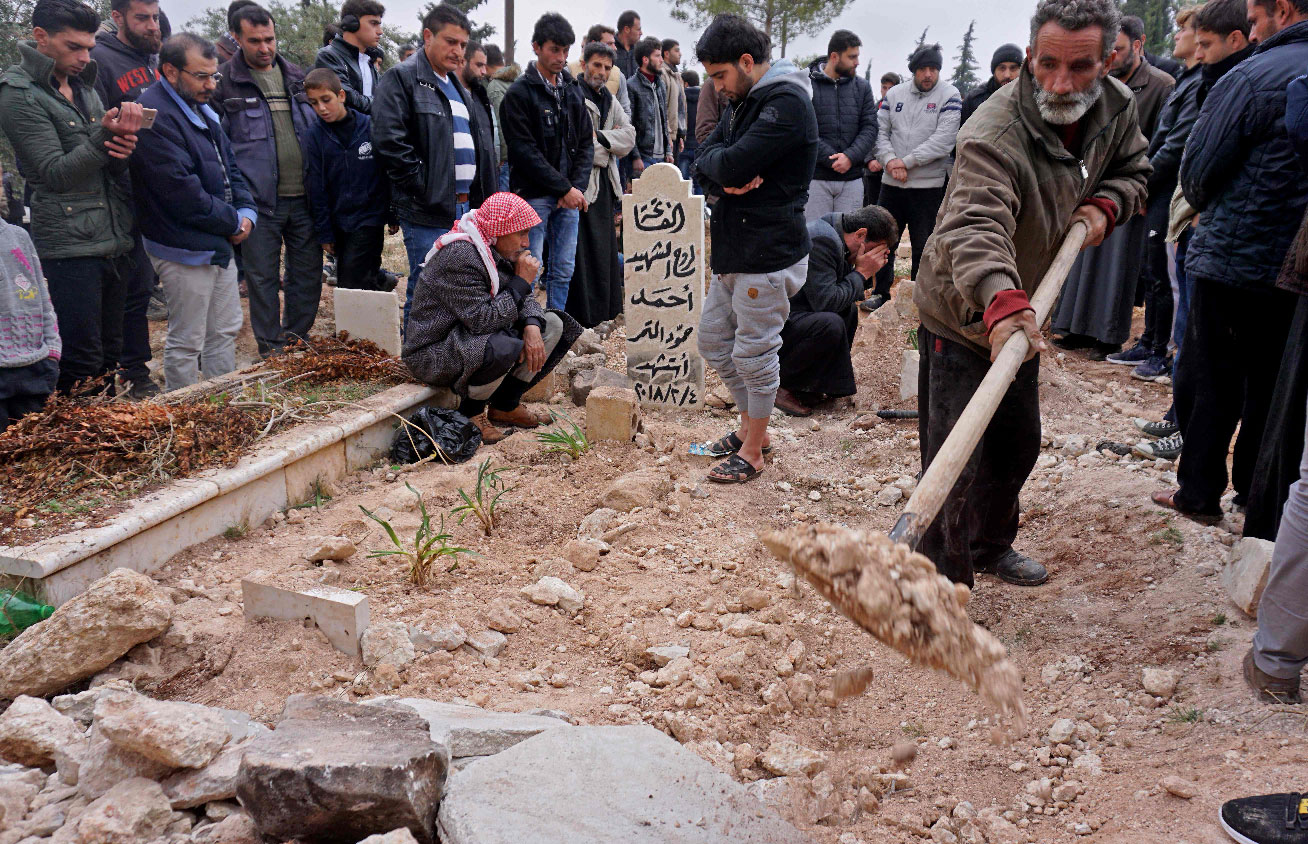 Mourners attend the funeral of Raed Fares and Hammoud al-Jneid in the village of Kafr Nabel in the northwestern province of Idlib on November 23, 2018.
