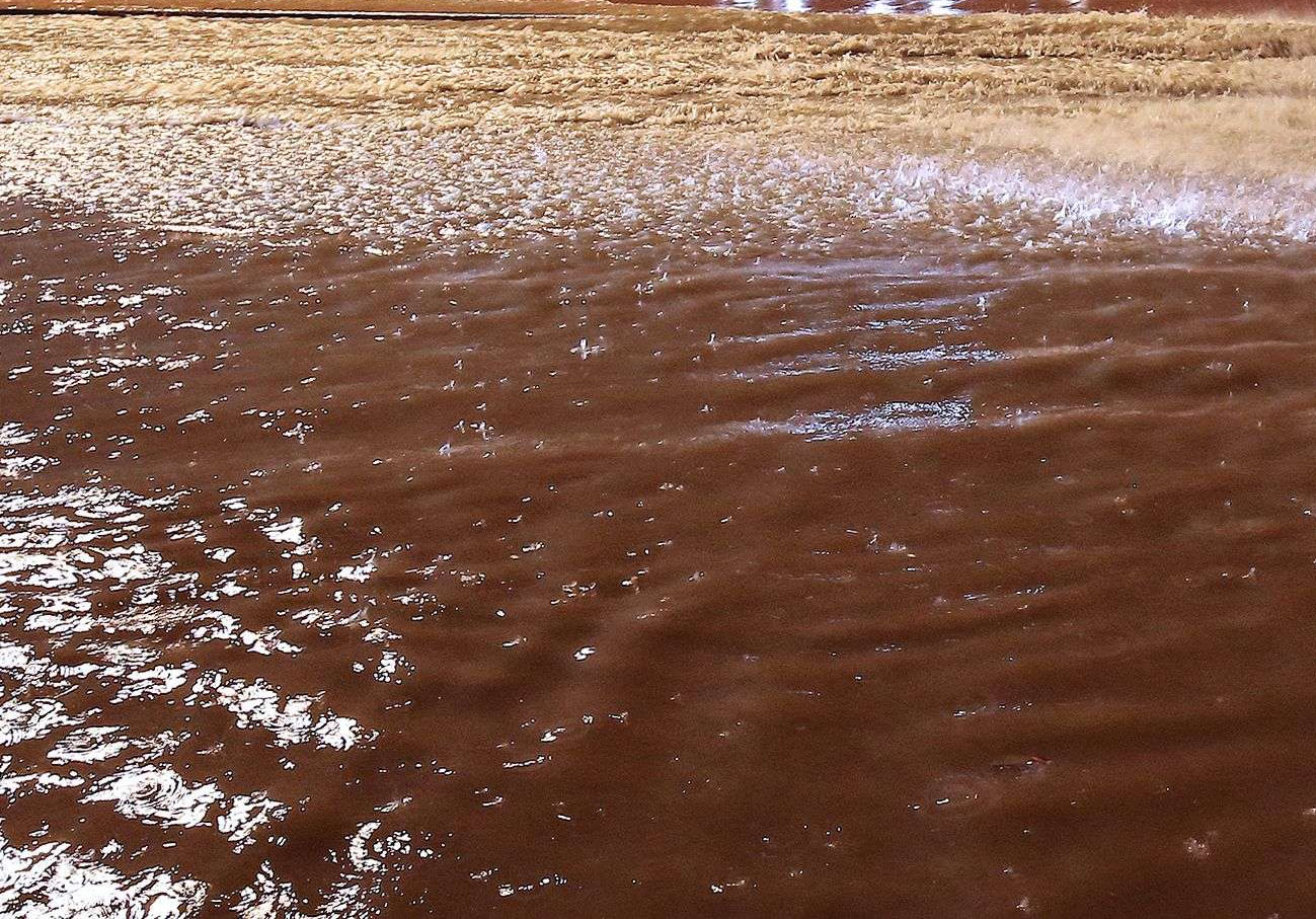 Floods have uncovered and carried away scores of mines, bombs and ammunition left by the Iraqi army in desert areas