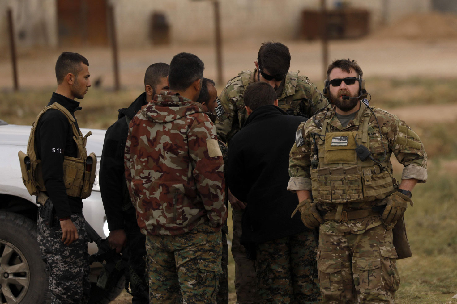 US forces and members of the Syrian Democratic Forces (SDF) patrol the Kurdish-held town of Al-Darbasiyah in northeastern Syria bordering Turkey on November 4, 2018. 