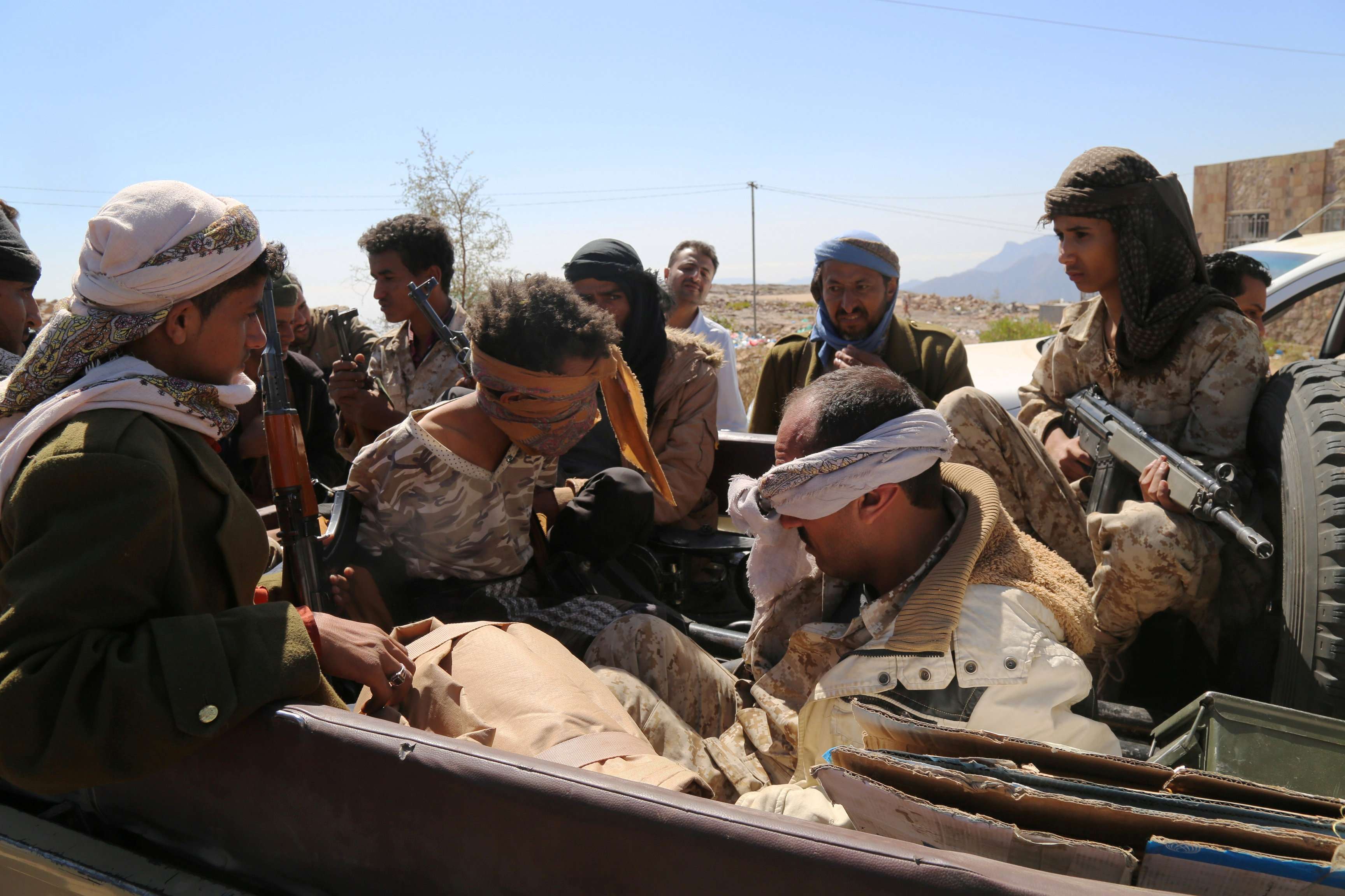 Two Houthi fighters are taken prisoners by pro-government fighters in Taiz, Yemen January 30, 2018.