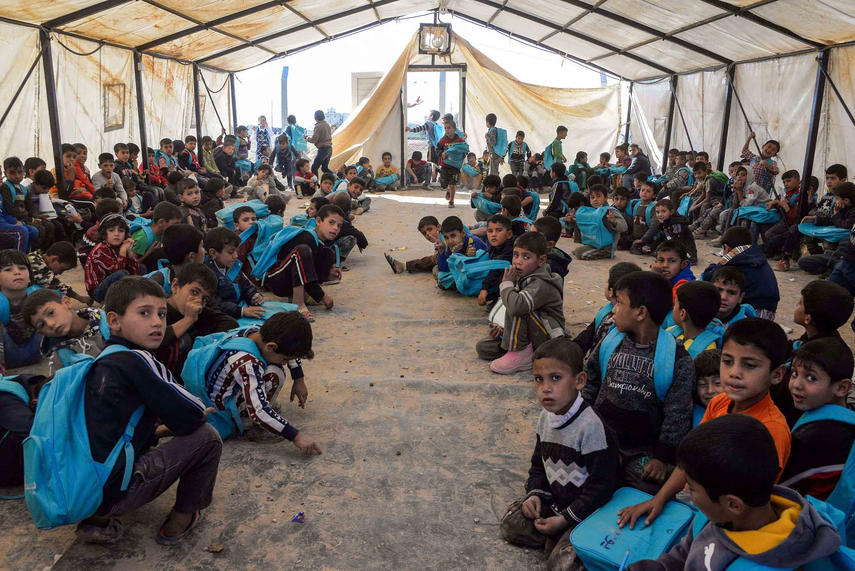 Over the years, Hammam al-Alil 2 became a bustling settlement: rows of tents with water and electricity access, plus storefronts, playgrounds, and a health centre