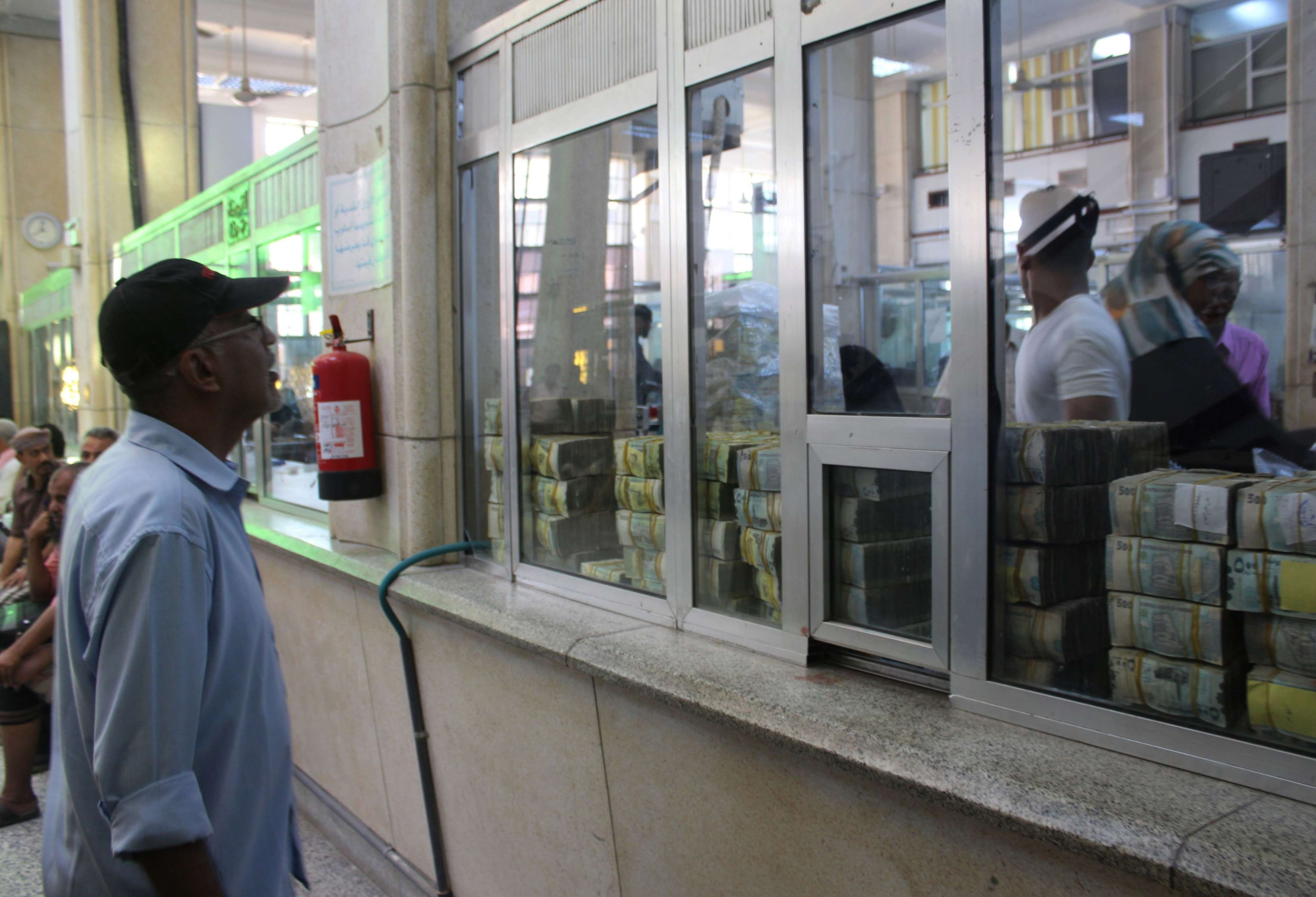 A Yemeni man is seen at the Central Bank of Aden in Aden on December 13, 2018.