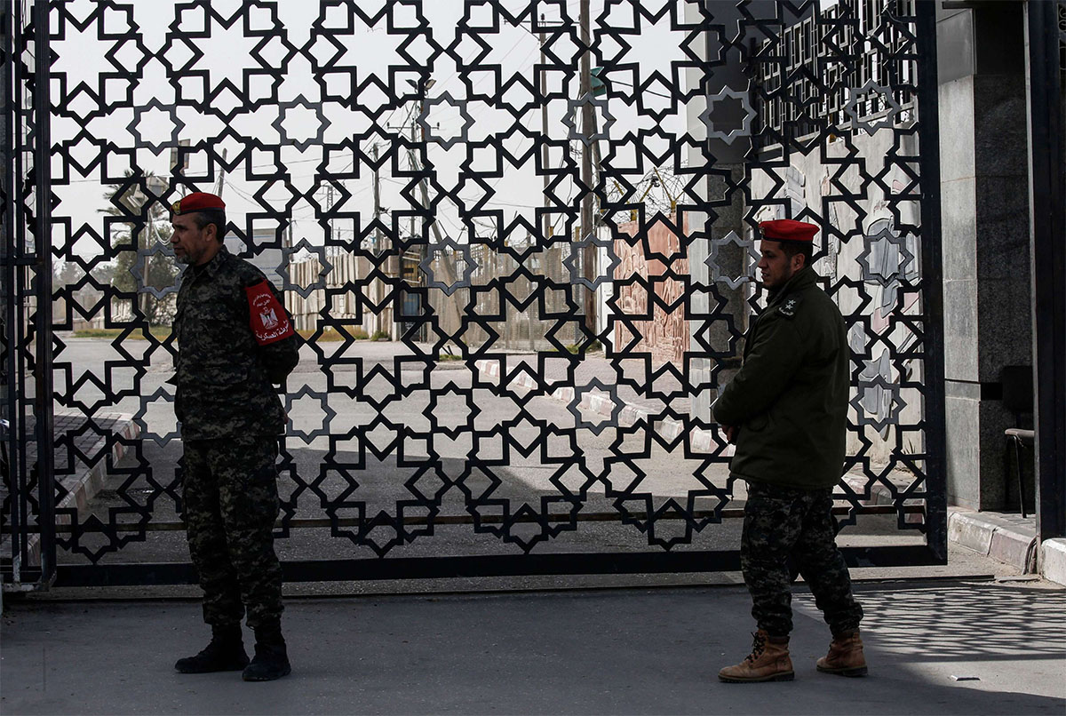 Palestinian security forces loyal to Hamas stand at the Rafah crossing point between Egypt and the southern Gaza Strip