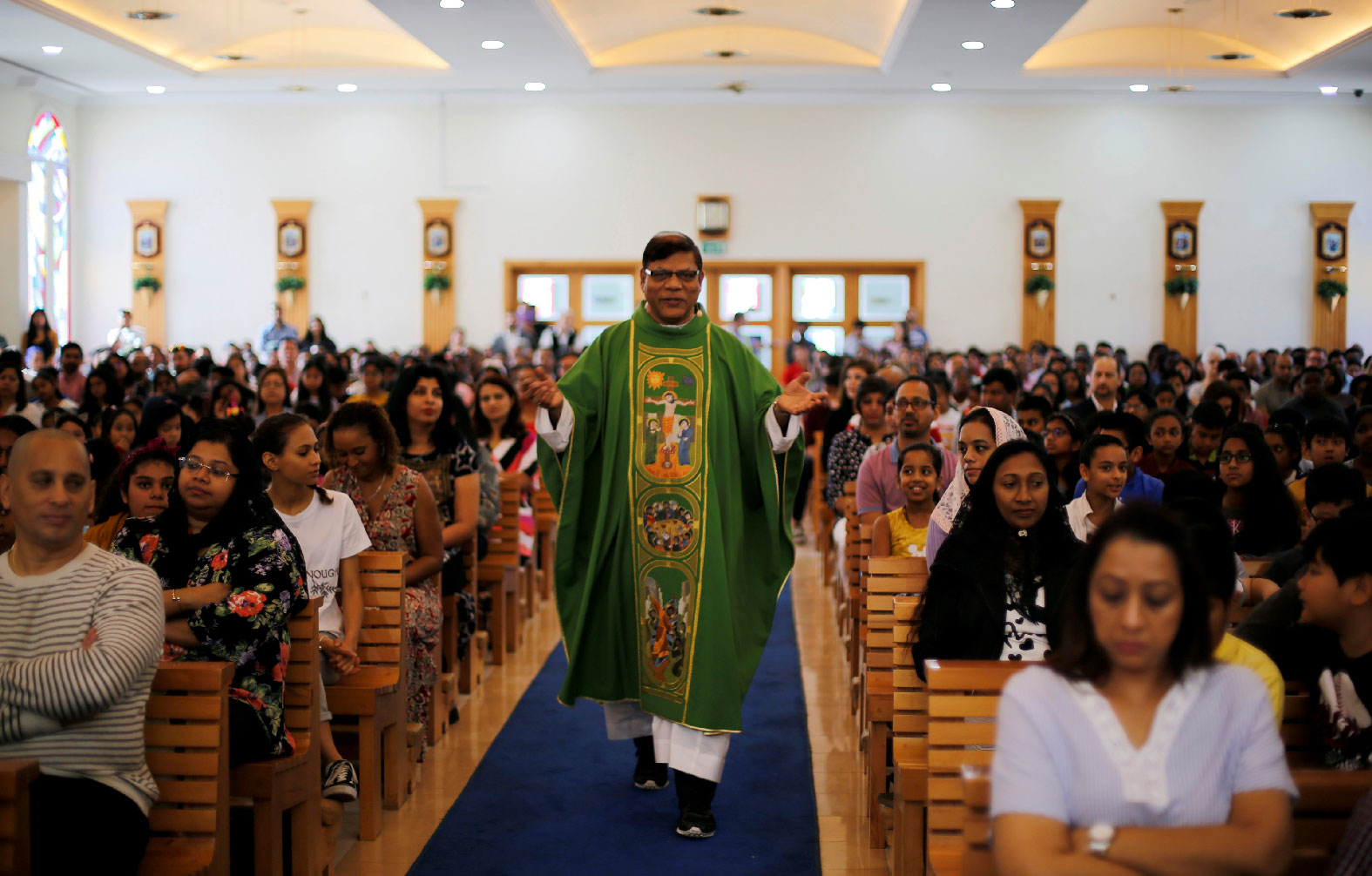 The expat bishop walks between the worshippers during the mass at St. Francis of Assisi Catholic Church in Jebel Ali, as Catholics are awaiting a historical visit by Pope Francis to the United Arab Emirates, in Dubai, UAE January 18, 2019.