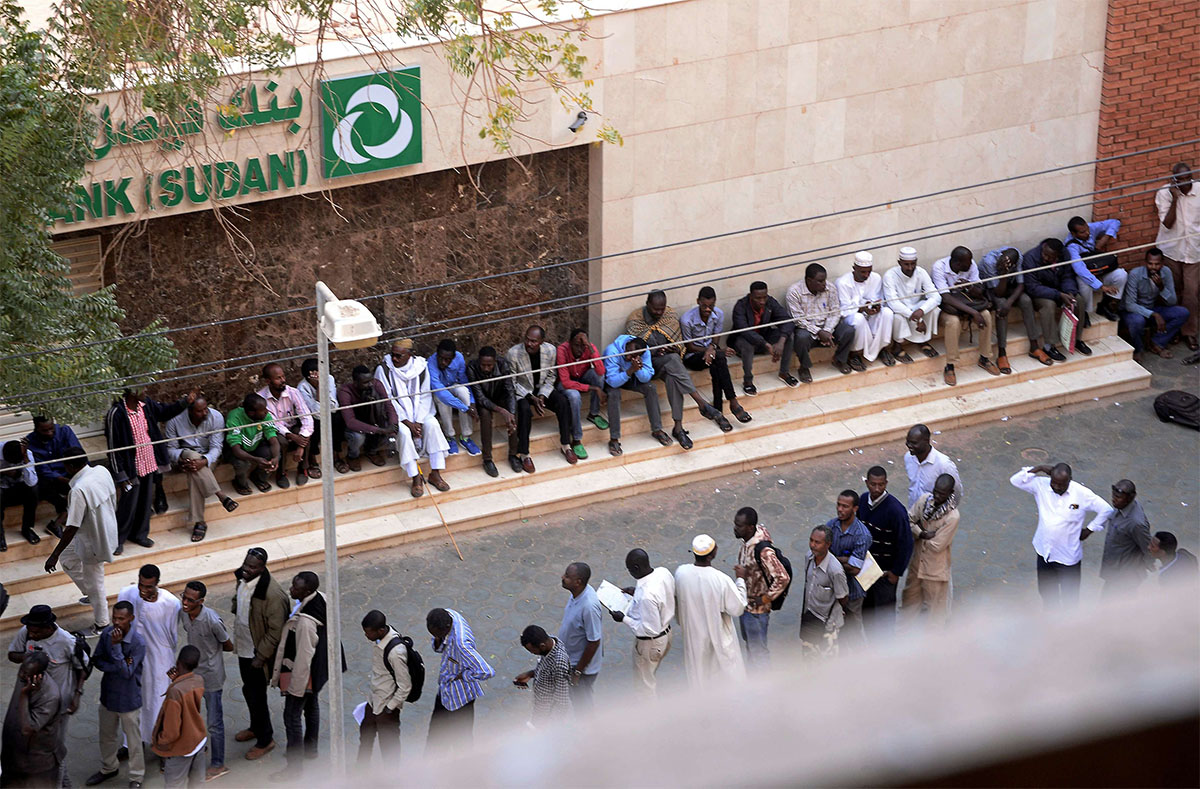 Many residents have to line up for hours to withdraw money
