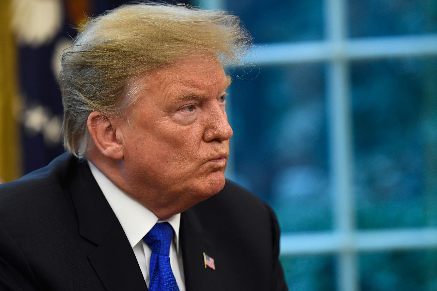 President Donald Trump listens during his meeting with Chinese Vice Premier Liu He in the Oval Office of the White House in Washington, Friday, Feb. 22, 2019.