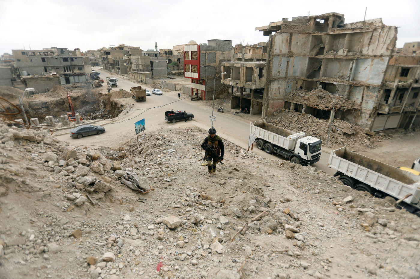 A member of the Iraqi security forces passed by bridges destroyed in the war with Islamic State, in the Old City of Mosul, Iraq, February 27, 2019.