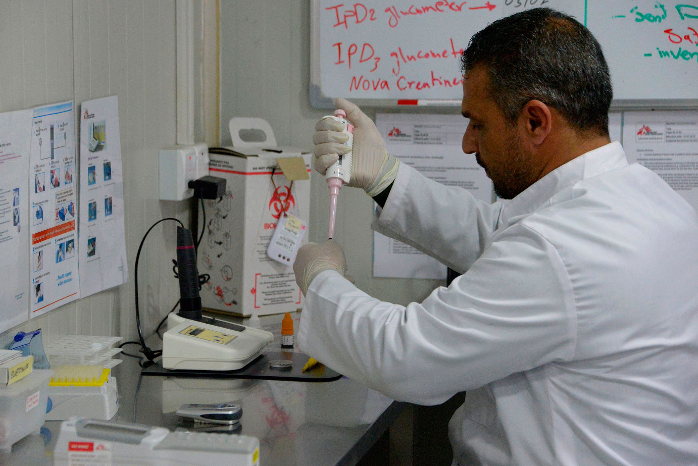 A staff member works at a lab in the Doctors Without Borders (MSF) hospital in Iraq's Mosul, on January 30, 2019.