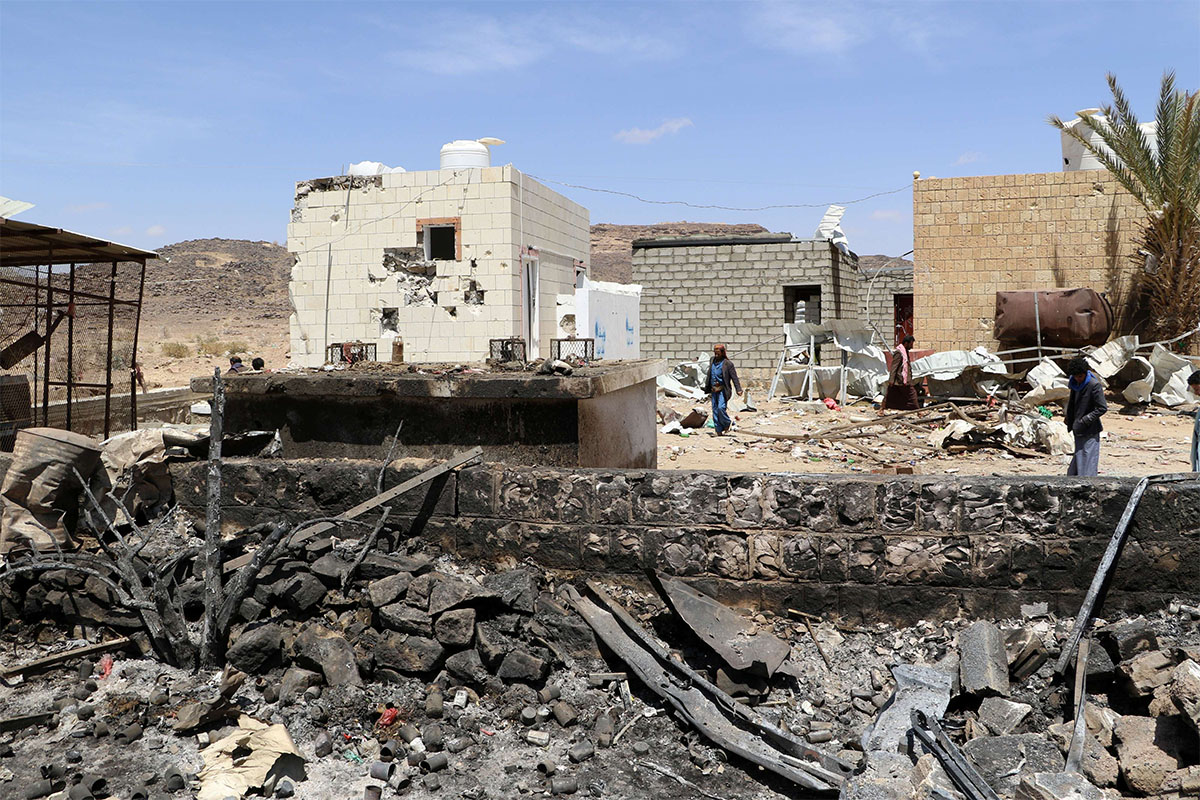 The scene of an air strike that hit a gas station near a hospital in Kutaf district of Saada province