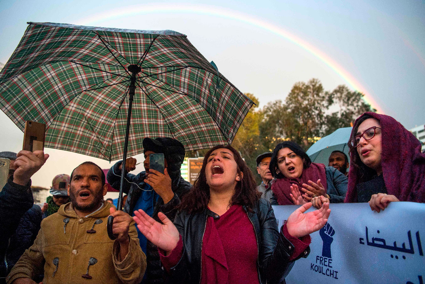 Supporters of Morocco's al-Hirak al-Shaabi movement shout slogans calling for the release of the movement's members outside the Casablanca Court of Appeals during their trial on April 5, 2019.