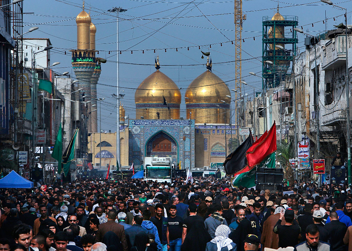 Shiite pilgrims gather outside the golden-domed shrine of Imam Moussa al-Kadhim, who died at the end of the 8th century, during the annual commemoration of the his death, in Baghdad, Iraq, Tuesday, April 2, 2019.