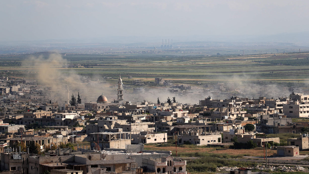 Plumes rising from shelling by government forces on the town of Khan Sheikhun