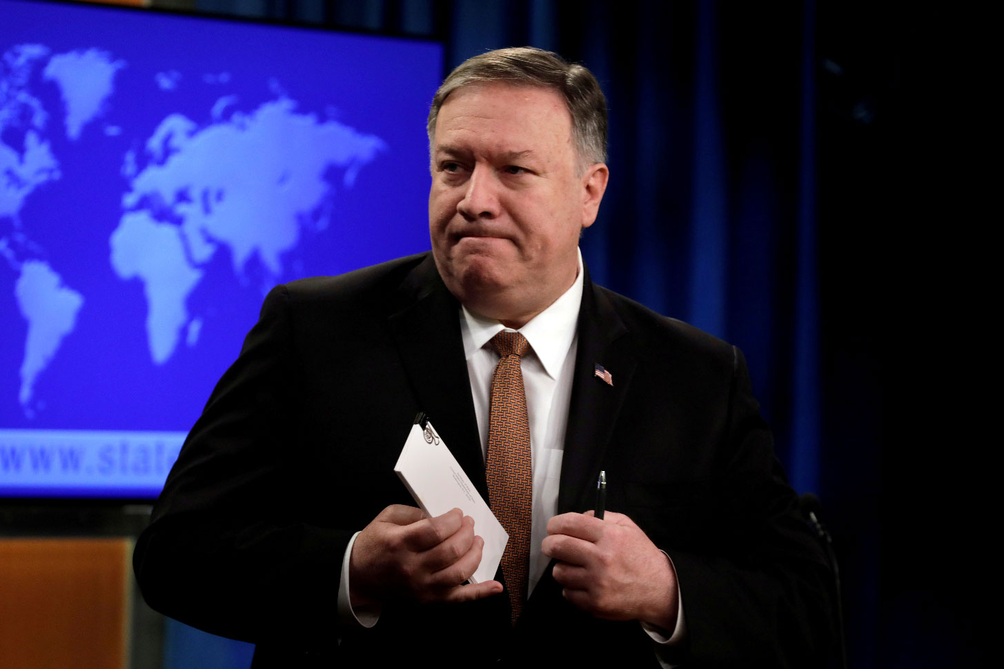 U.S. Secretary of State Mike Pompeo leaves after a briefing on Iran at the State Department in Washington