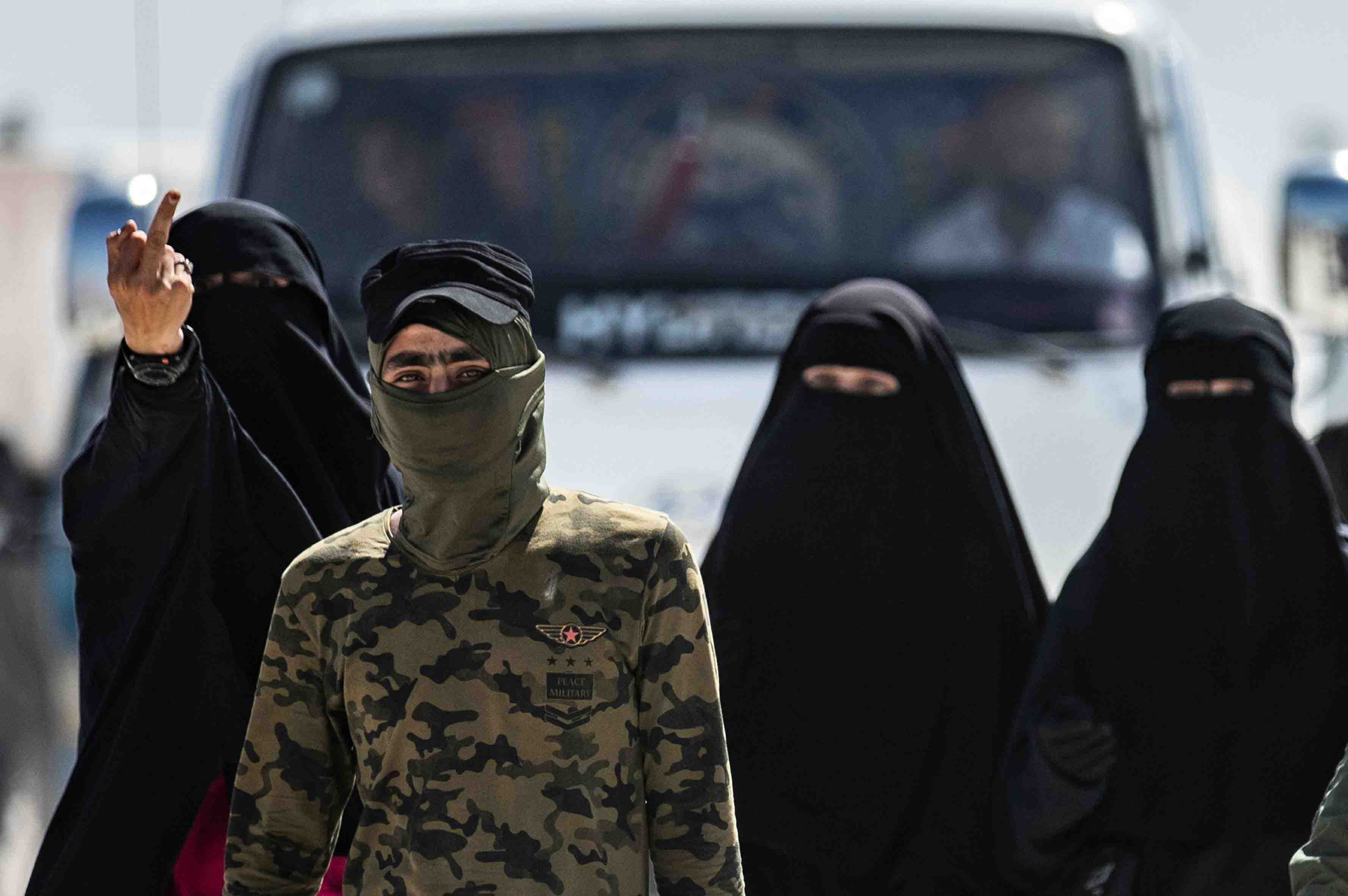 Unlike Syrian and Iraqi women who are allowed to roam the camp freely, these high-risk prisoners are escorted by armed guards