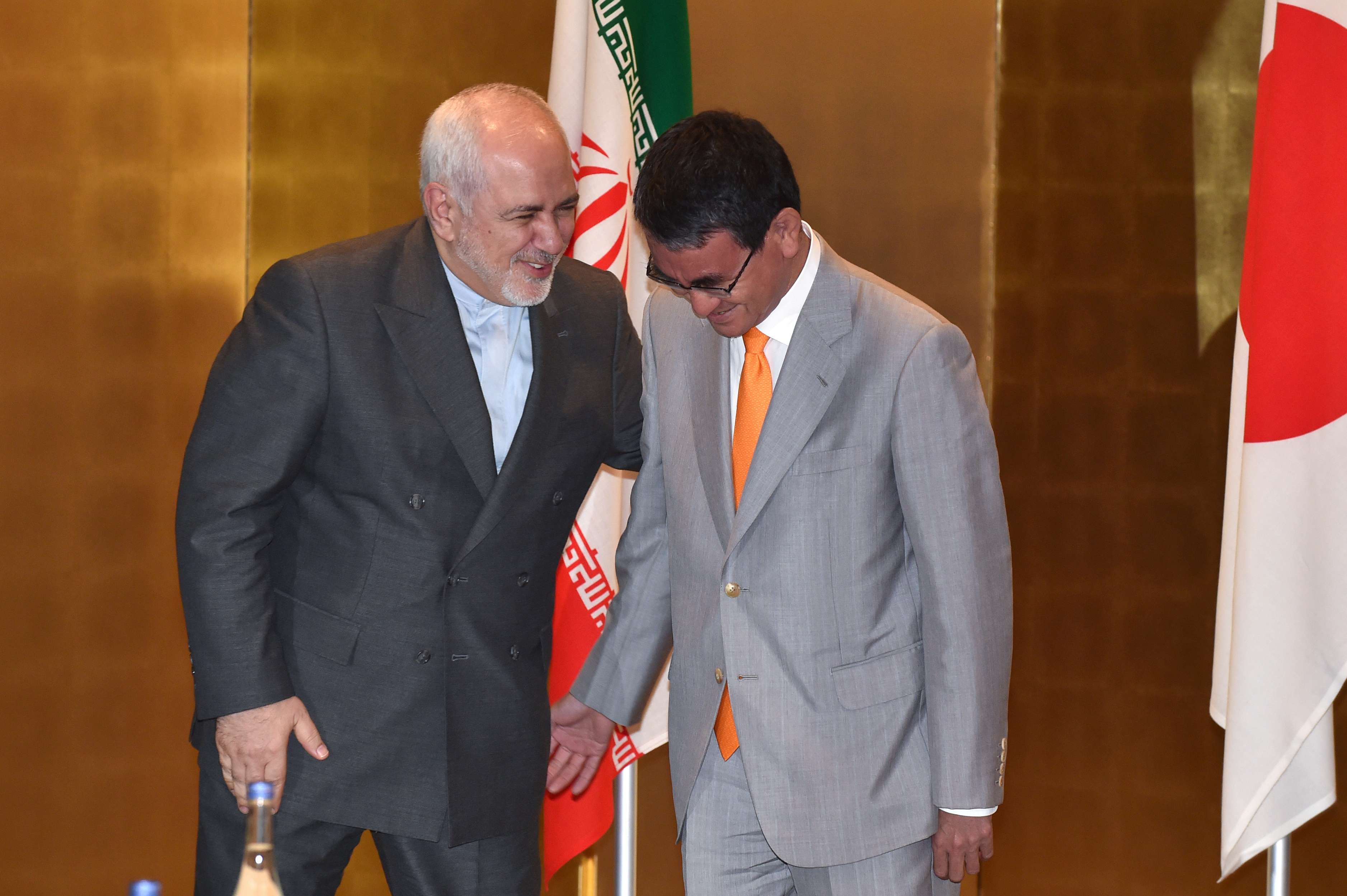 Iranian Foreign Minister Mohammad Javad Zarif talks with his Japanese counterpart Taro Kono