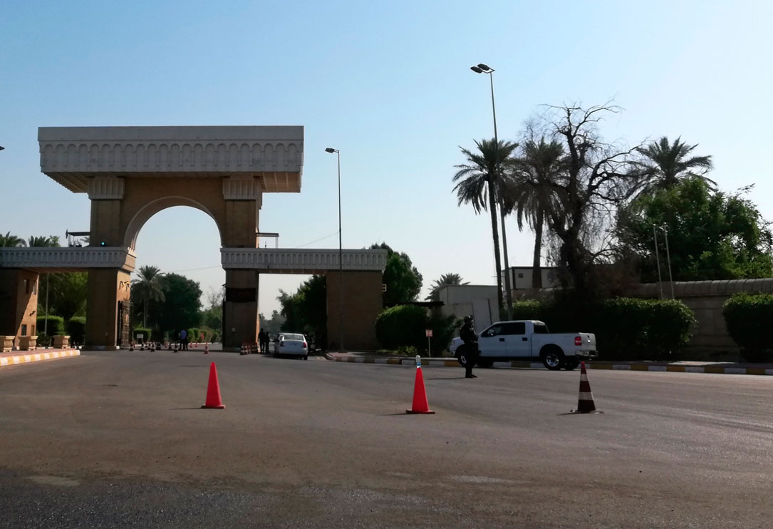 Iraqi security forces verify the identities of those entering the Green Zone in Baghdad
