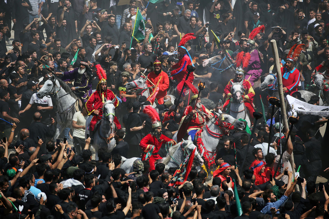Local actors dressed as ancient warriors re-enact a scene from the 7th century battle of Kerbala