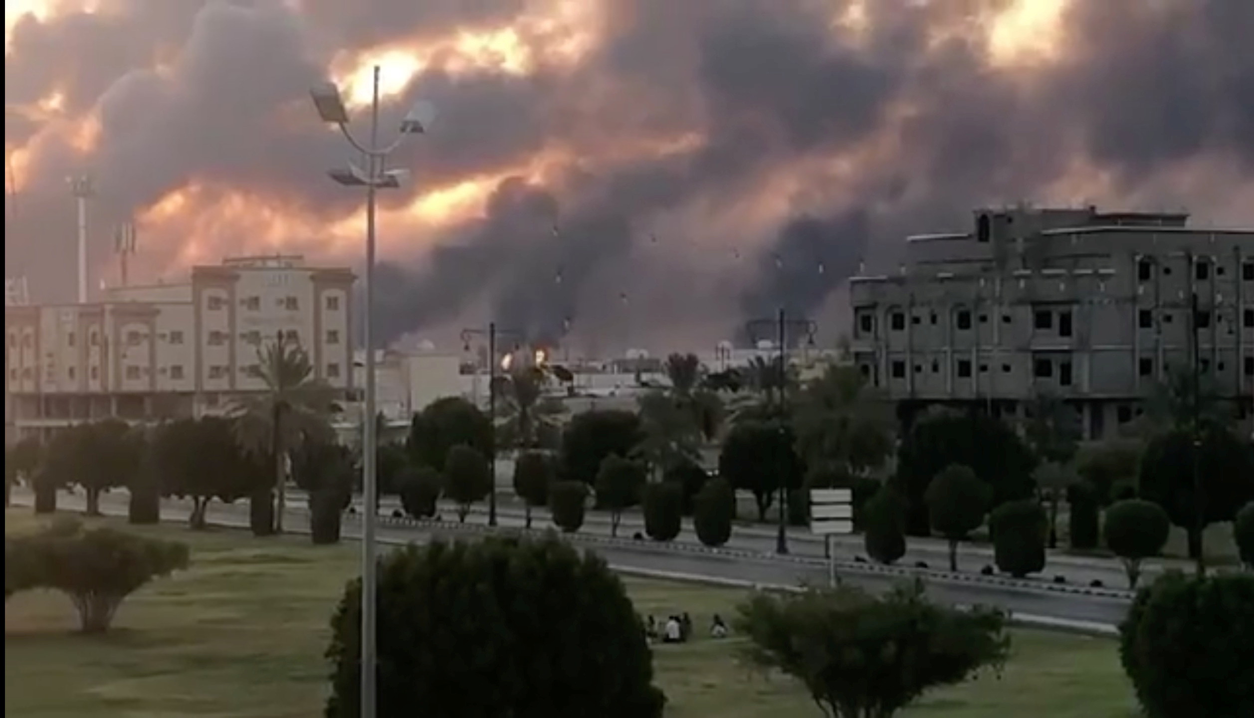 Smoke is seen following a fire at an Aramco factory in Abqaiq