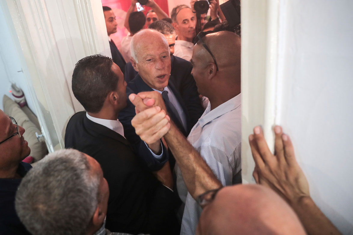 Tunisian independent law professor Kais Saied greets his supporters