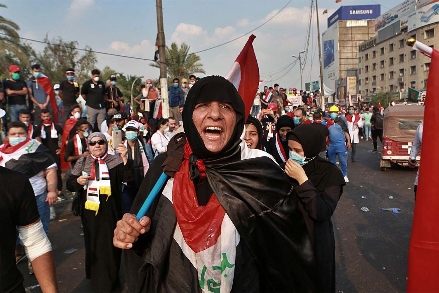 Iraqi women take part in the anti-government protests in Tahrir Square in Baghdad