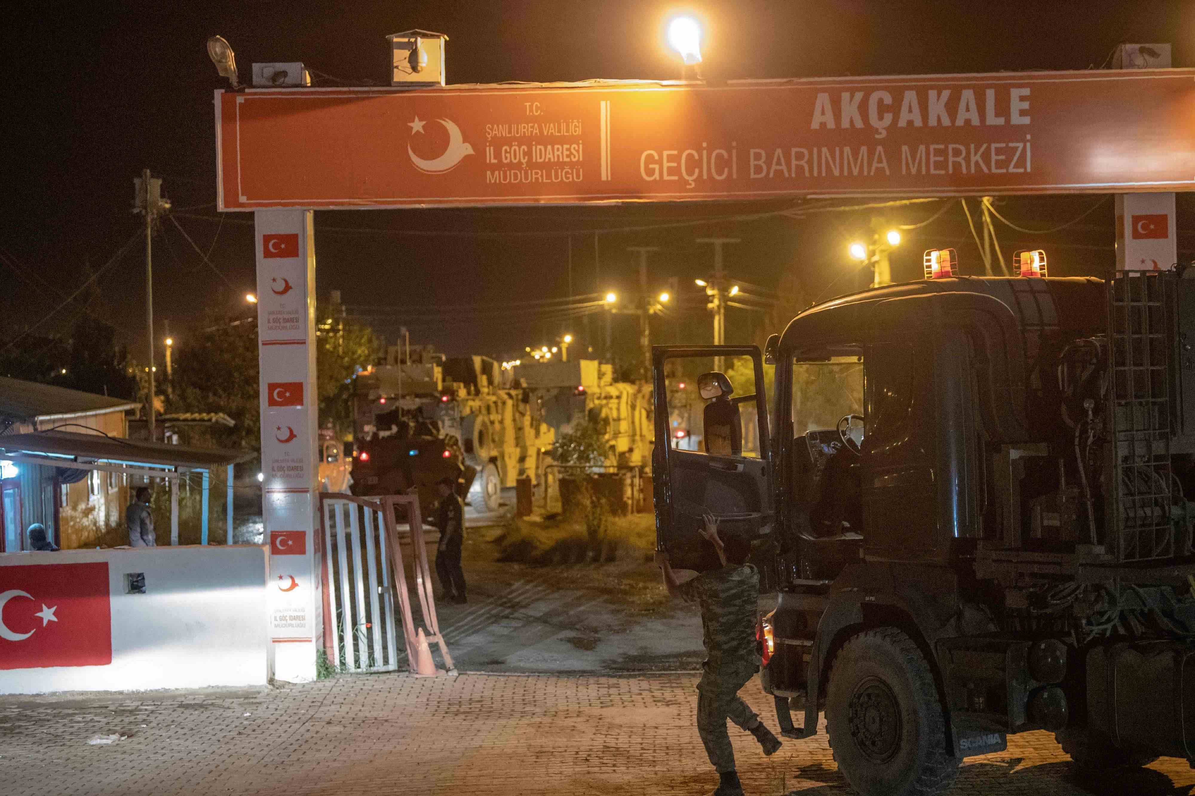 Turkish army soldiers drive towards the border with Syria near Akcakale in Sanliurfa province