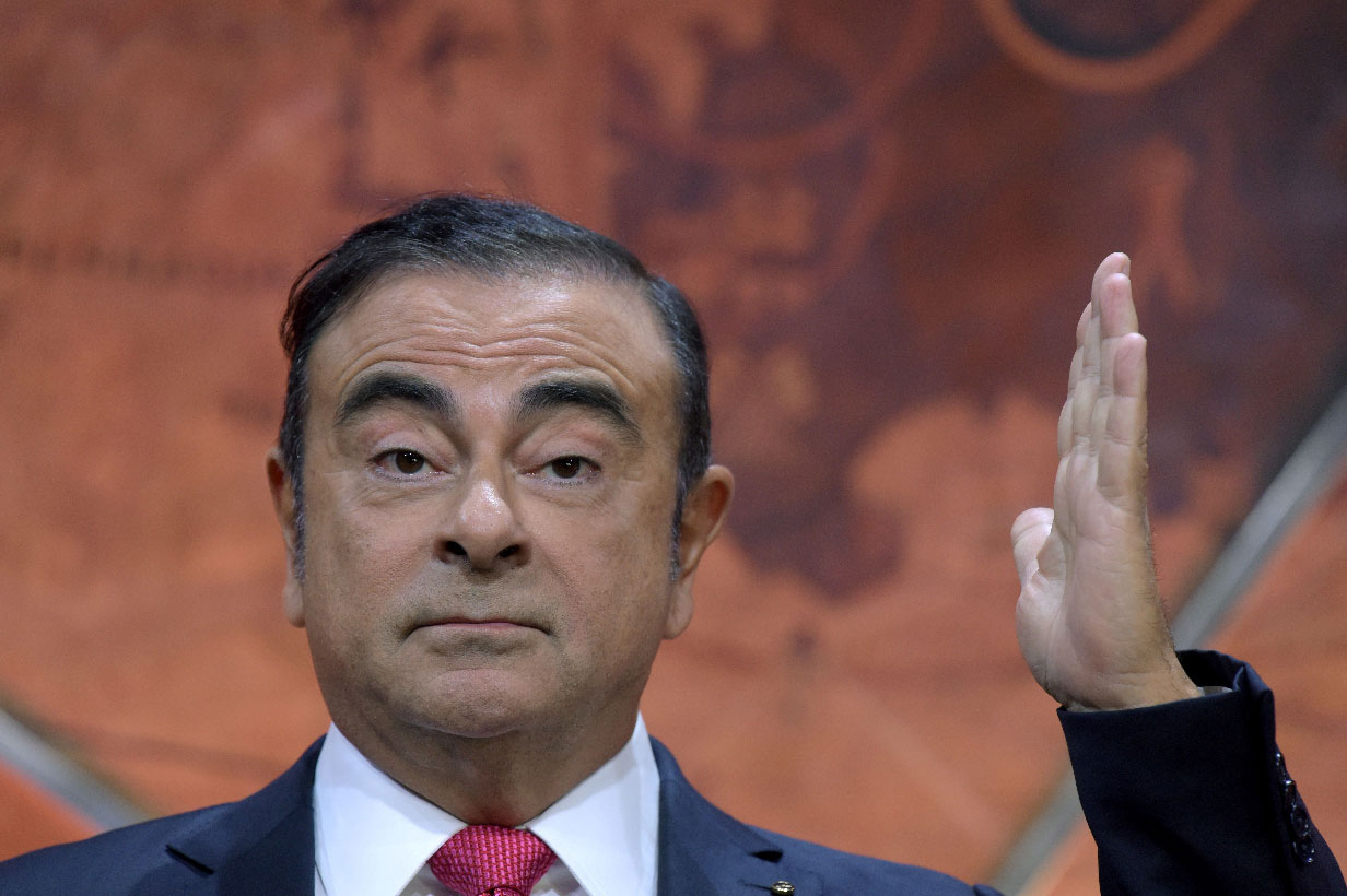Carlos Ghosn gestures as he addresses a press conference in Paris on September 15, 2017