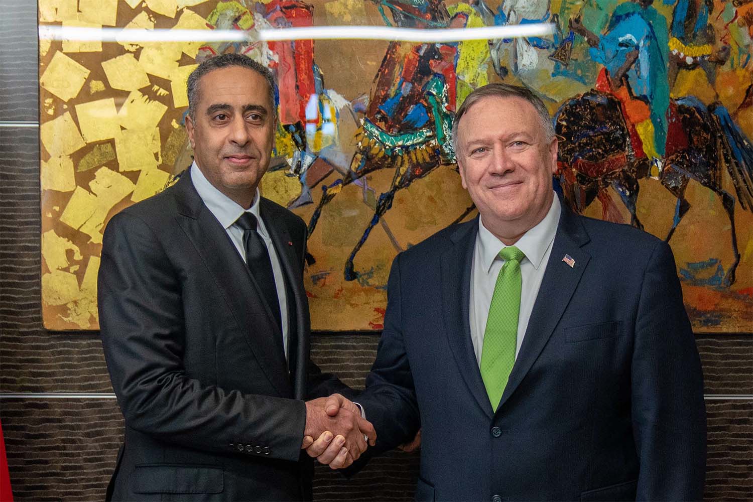 Pompeo shakes hands with Abdellatif Hammouchi, the head of the General Directorate for Territorial Surveillance