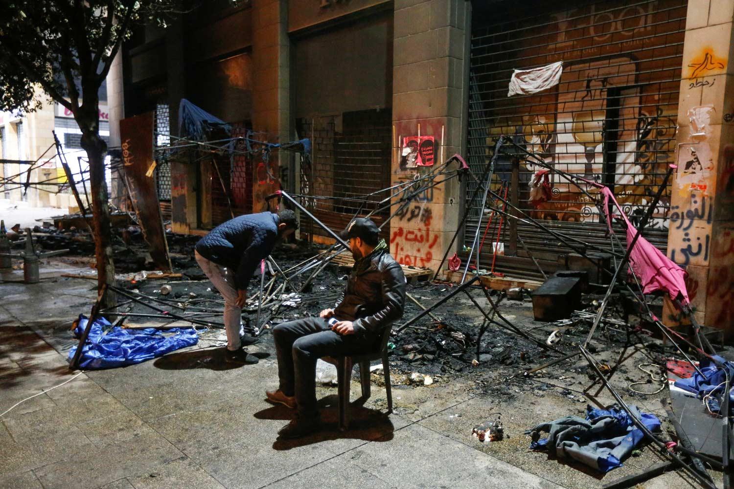 The violence began after dozens of protesters threw rocks and large plant pots at police
