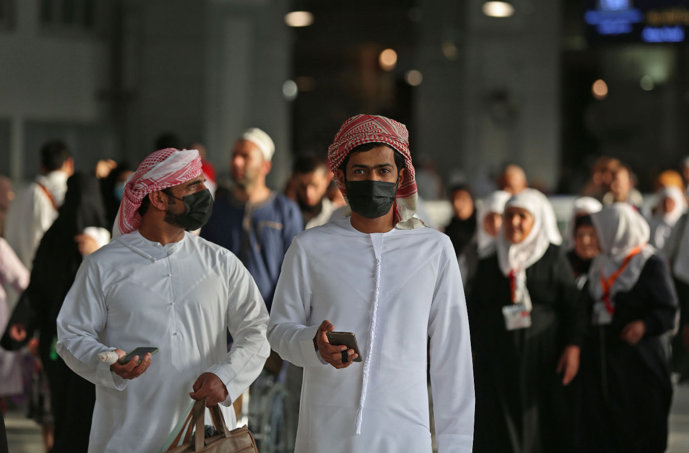 Muslim pilgrims wear masks at the Grand Mosque in Saudi Arabia's holy city of Mecca