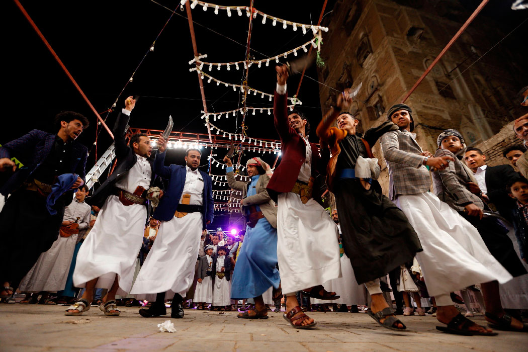 Yemenis dance at a wedding ceremony in the old city of Sanaa on December 19