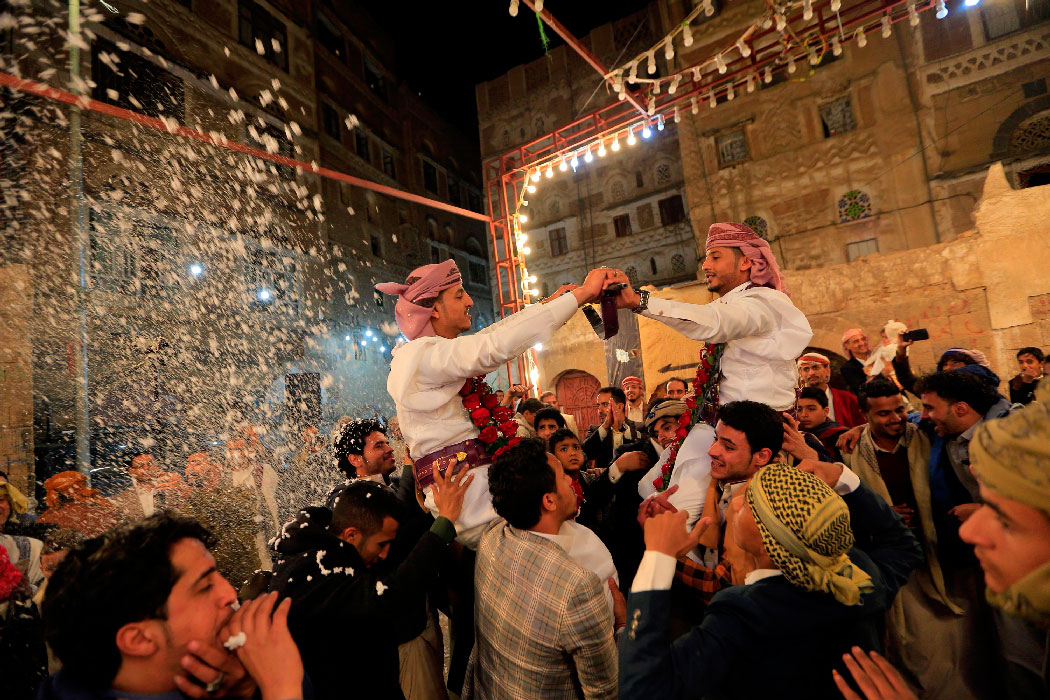 Yemenis dance at a wedding ceremony in the old city of Sanaa on December 19, 2019