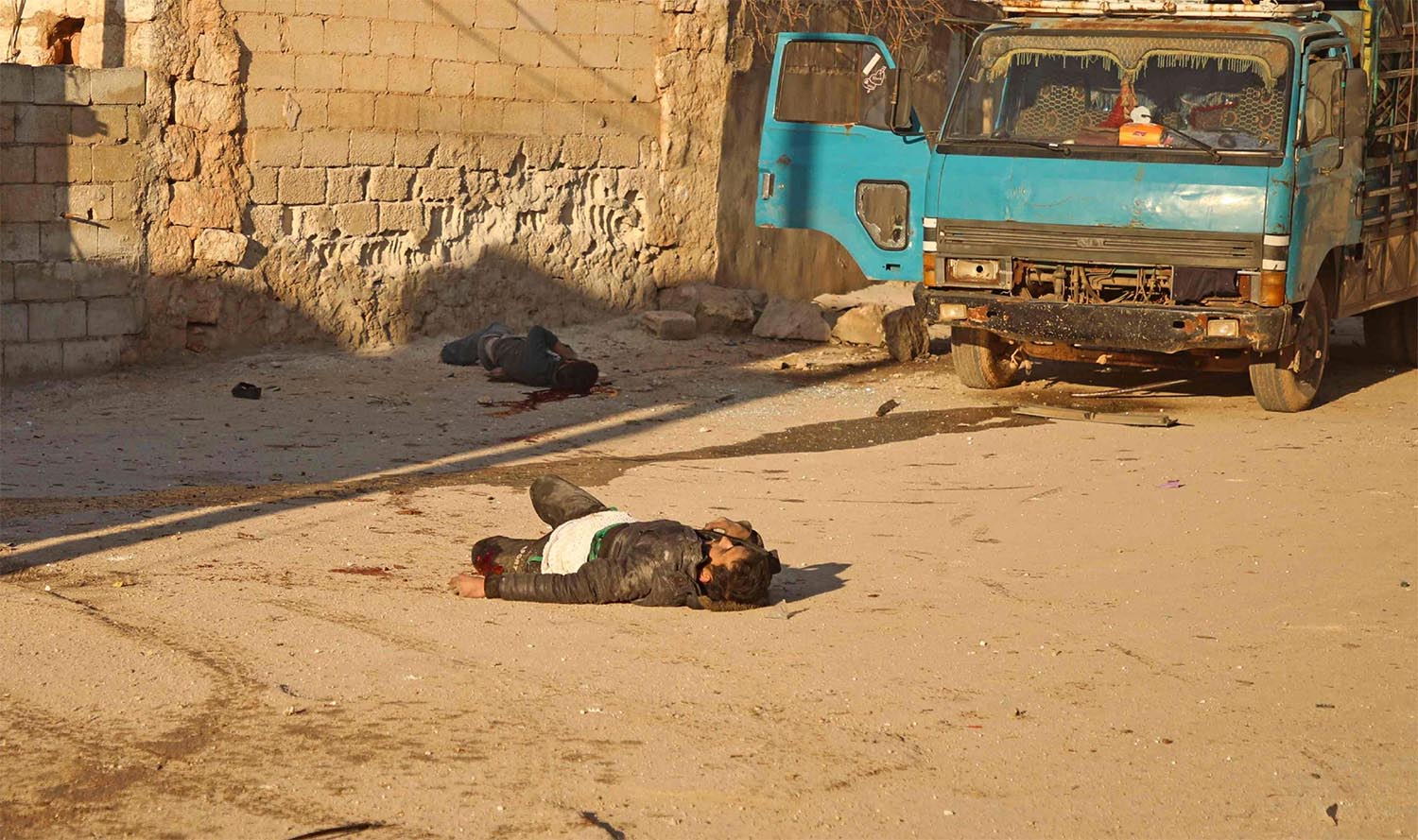  Two bodies following a reported barrel bomb attack by Syrian government forces on the village of Kafr Nuran in the northern province of Aleppo