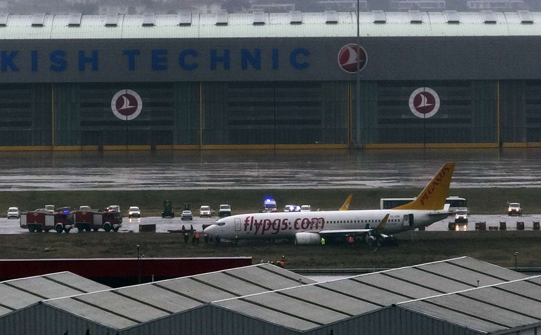Live images broadcast on Turkish television showed several people climbing through a large crack in the plane