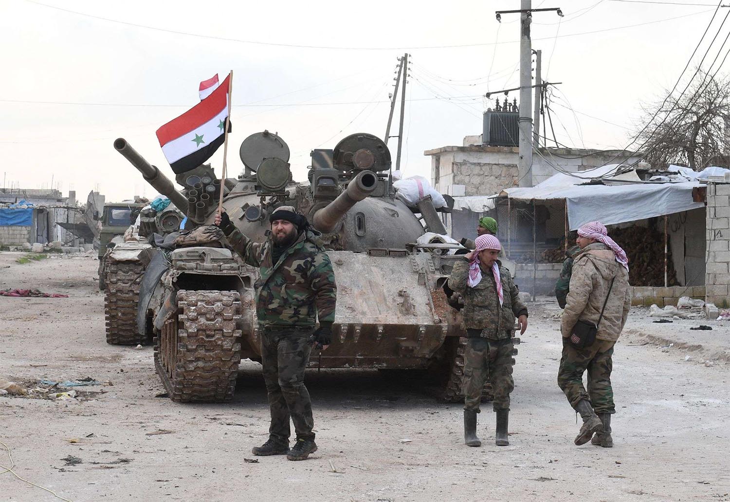 Syrian government forces deploy near the Damascus-Aleppo highway in the southern part of Syria's northern Aleppo province 