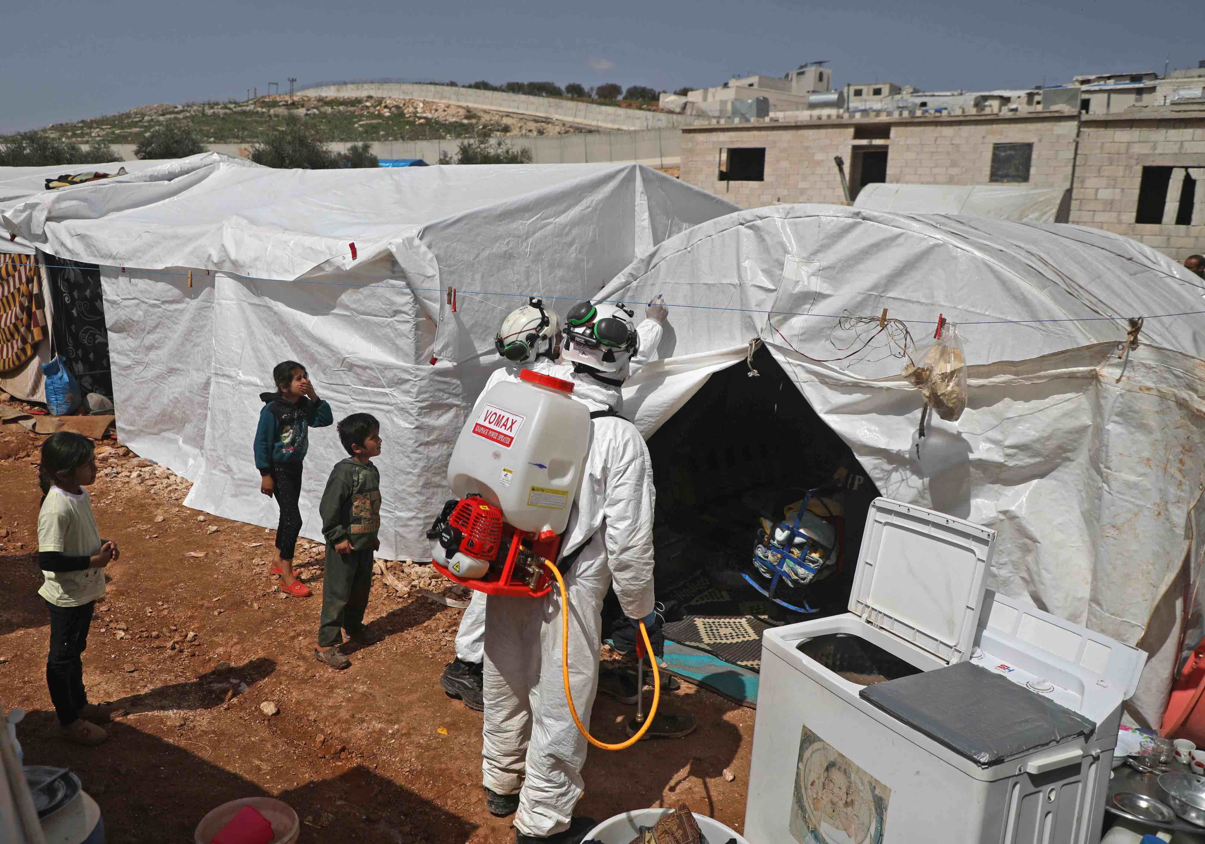 As part of the effort to prevent the worst in the rebel-held Idlib region, a doctor is visiting Yassin's camp in Kafr Lusin to raise awareness