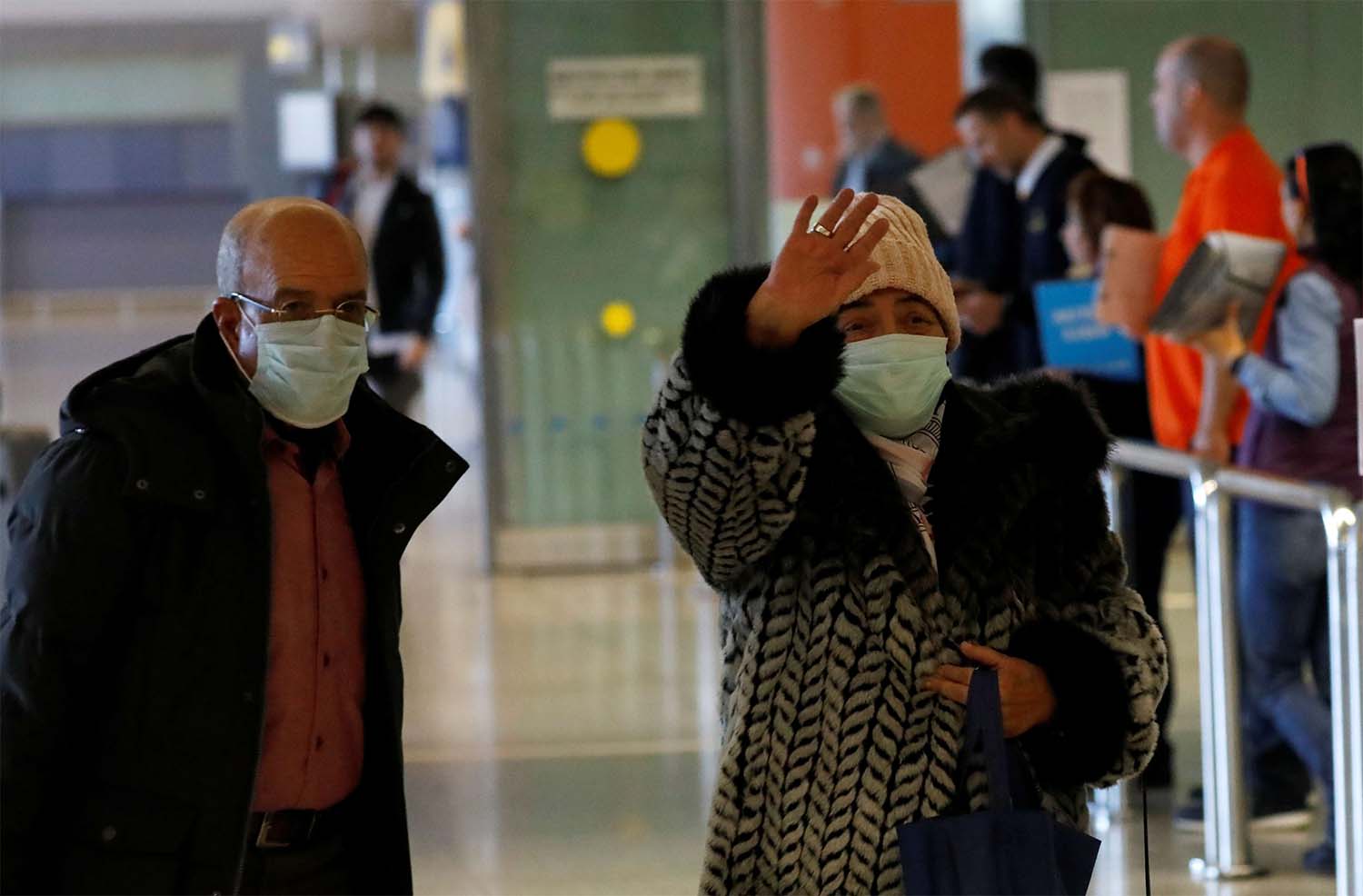 Moroccans wearing masks