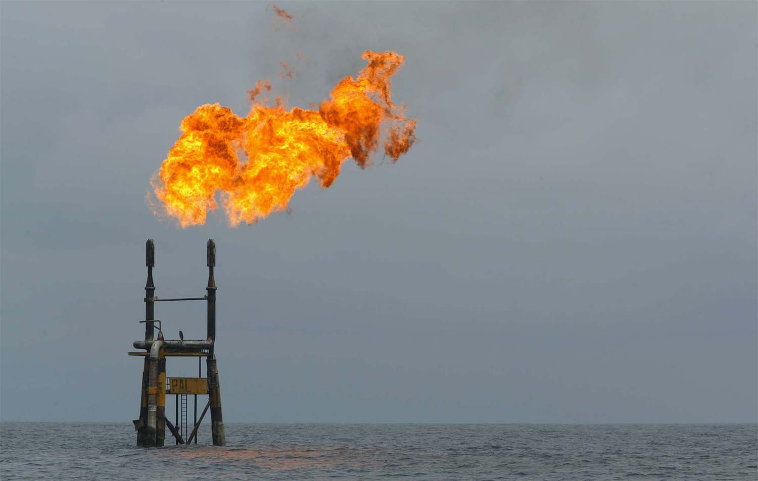 Flames rise from a Total Elf Fina offshore oil rig off the Angolan coast.
