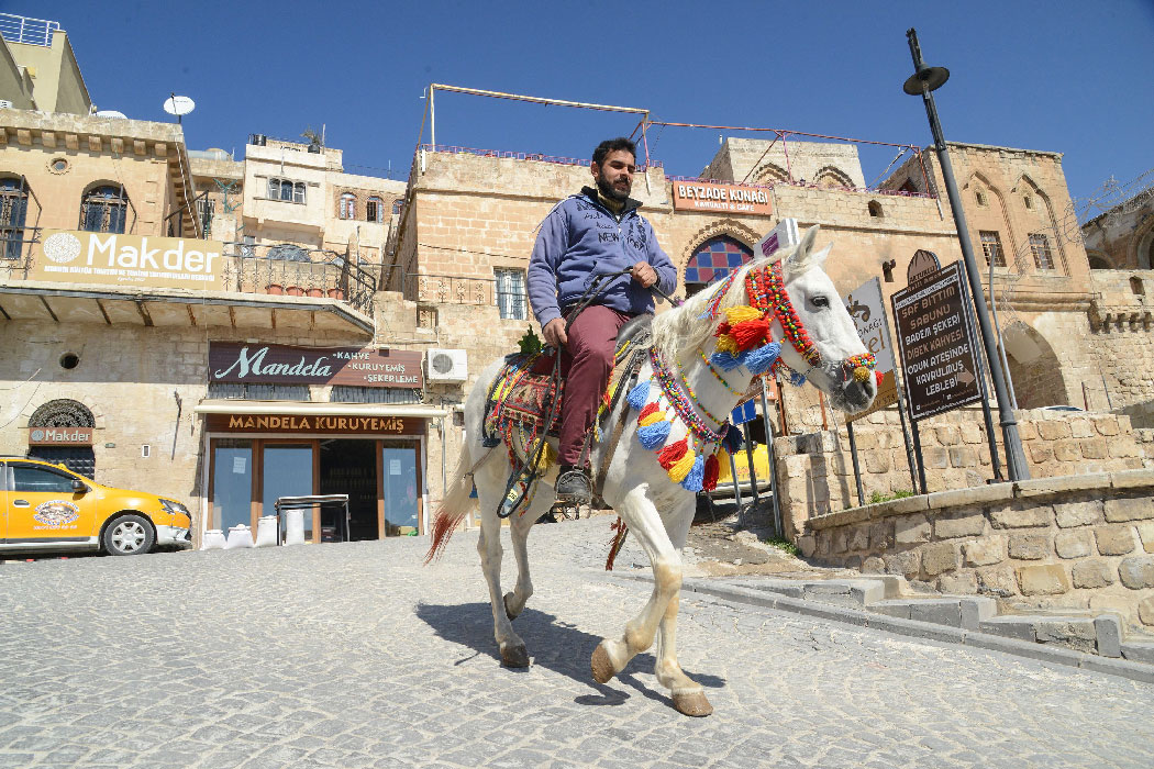 A man rides a horse in the south-eastern Turkish city of Mardin