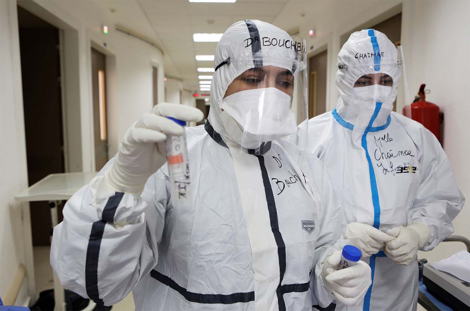 Doctor Meryem Bouchbika holds a sample tube in the Intensive Care Unit (ICU) at Prince Moulay Abdellah hospital 