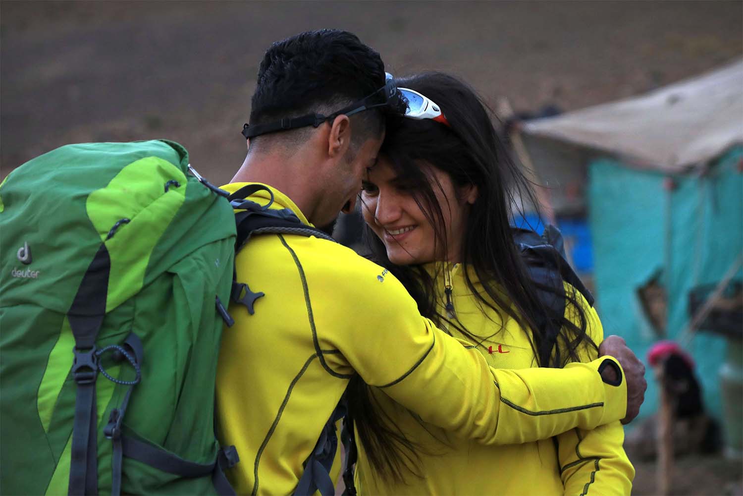 Newlyweds Iraqi Kurds Salar Chomany, 34, and Soma Mohammed, 28, walk together during a trekking ceremony at Mount Halgurd