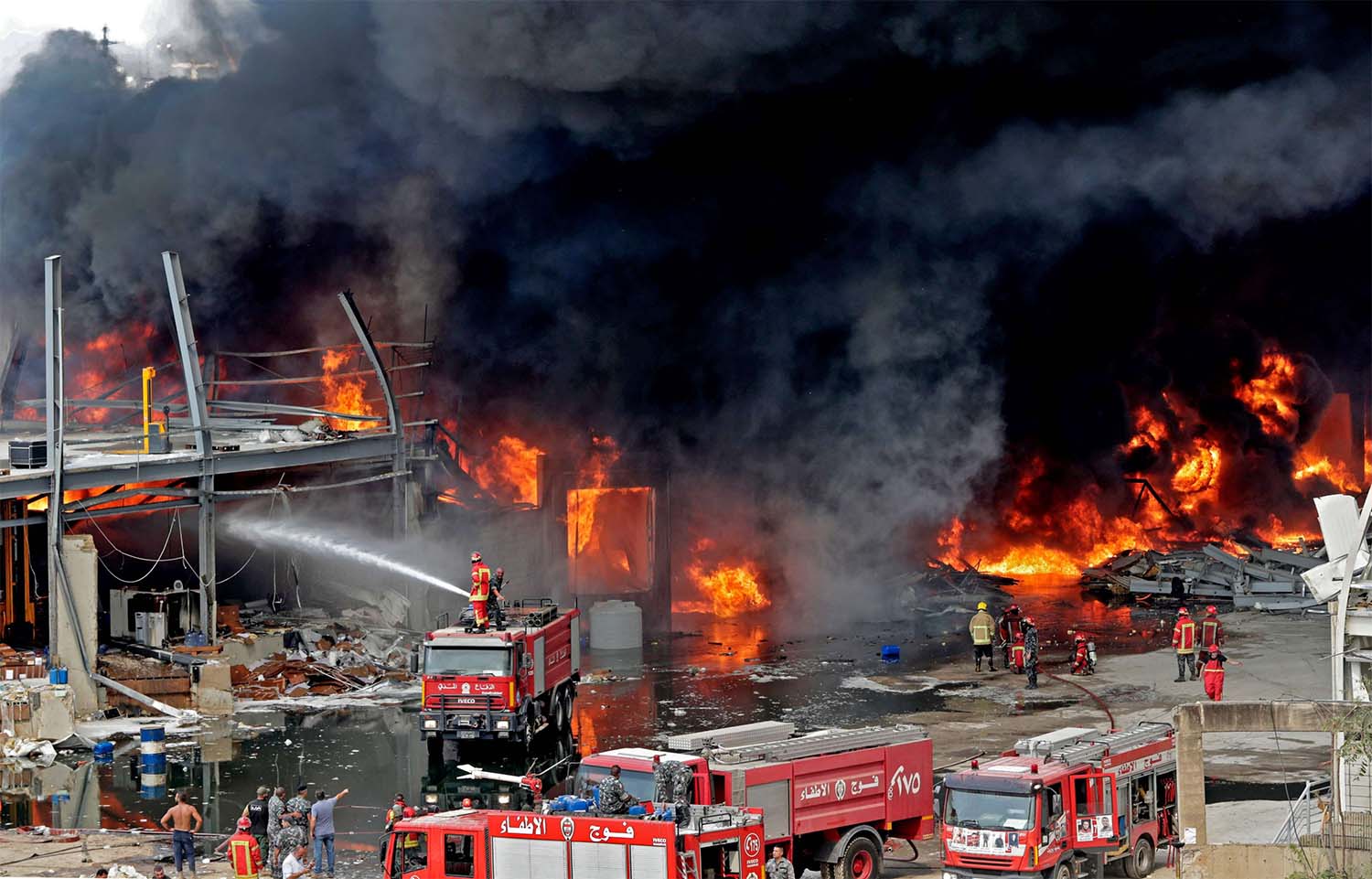 Some Beirut residents have fled the city as fire sends up huge plume of smoke