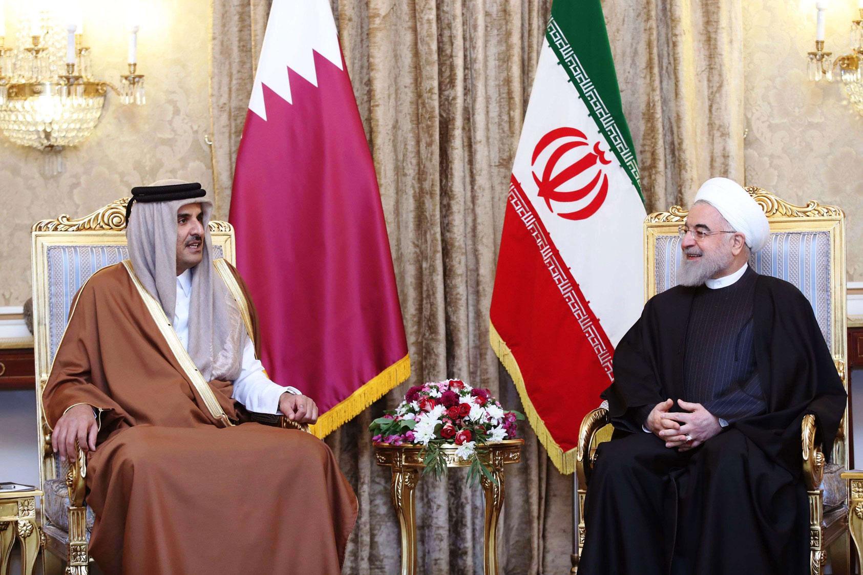 امير قطر الشيخ تميم بن حمد ال ثاني والرئيس الايراني حسن روحاني