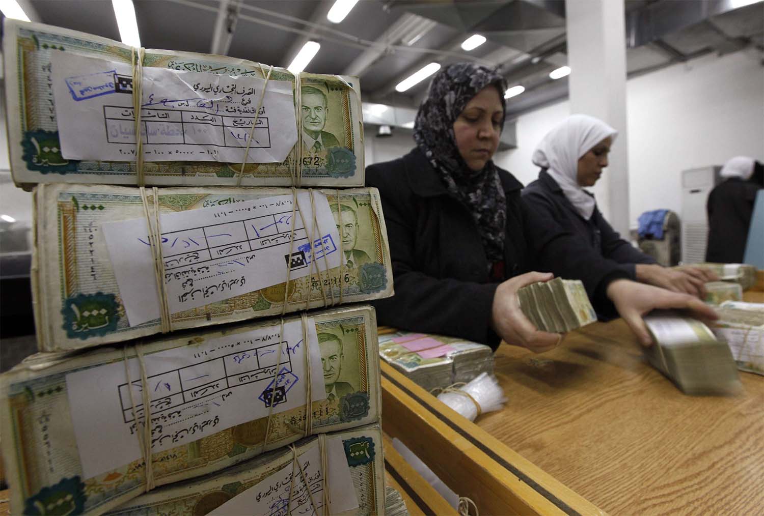 50,000 Syrian pounds, which is nearly $11 on the black market, will go to public sector workers