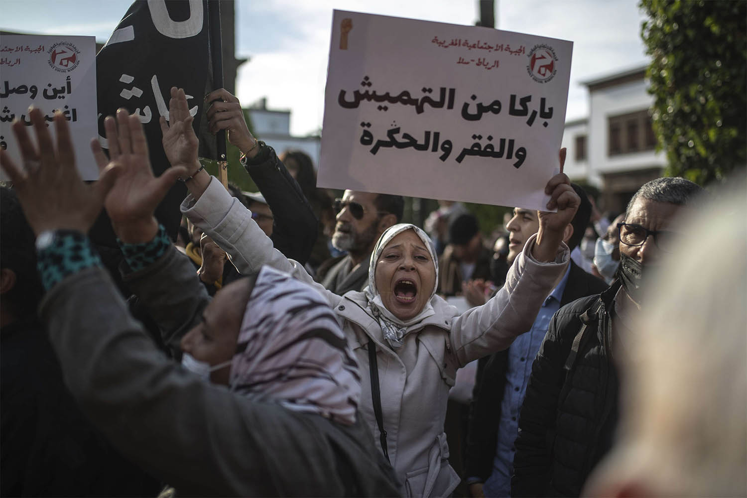"Enough neglect, poverty and humiliation," reads the banner