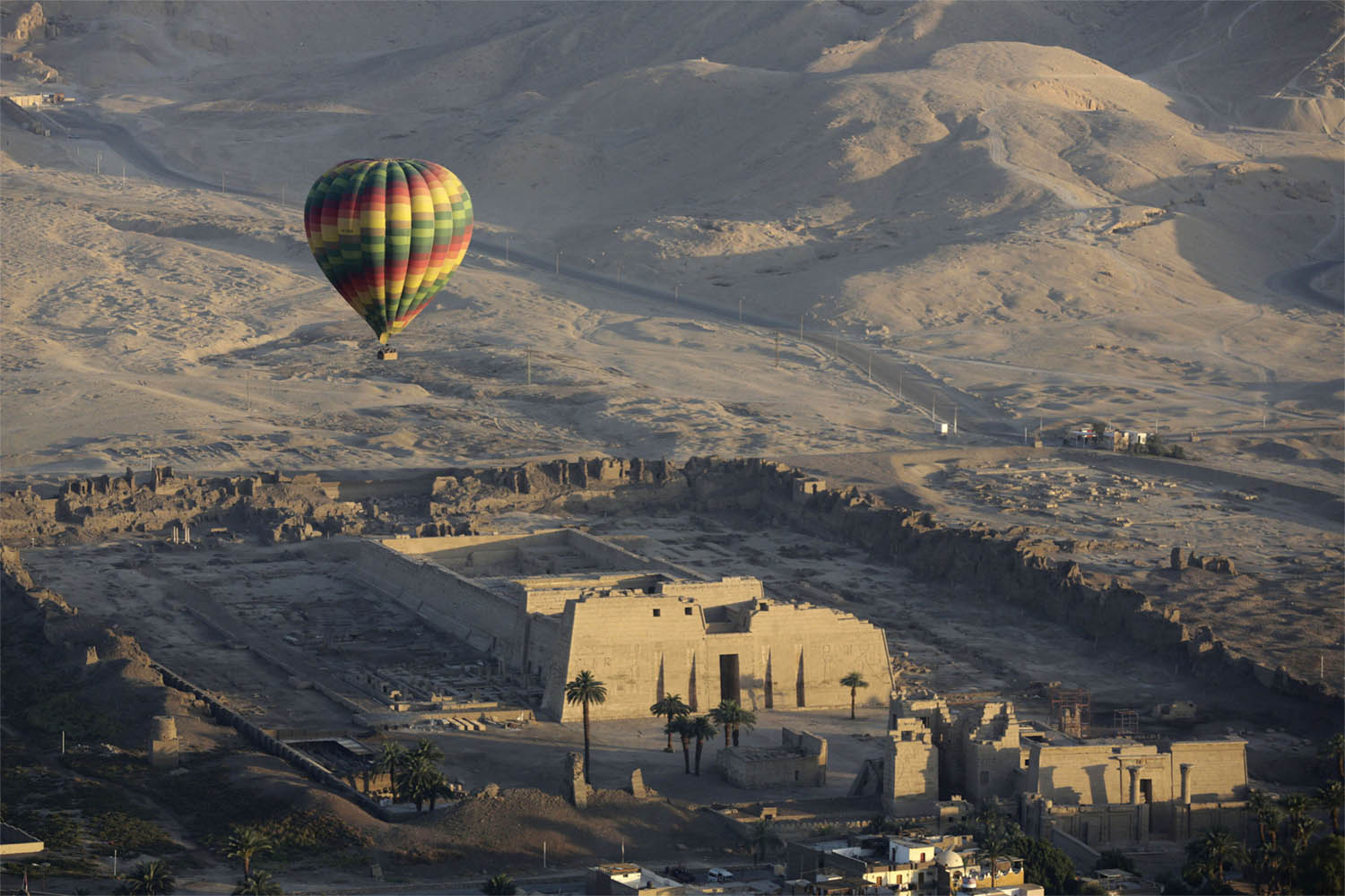 Hot air ballooning over Luxor offers tourists spectacular views of ancient temples in the city