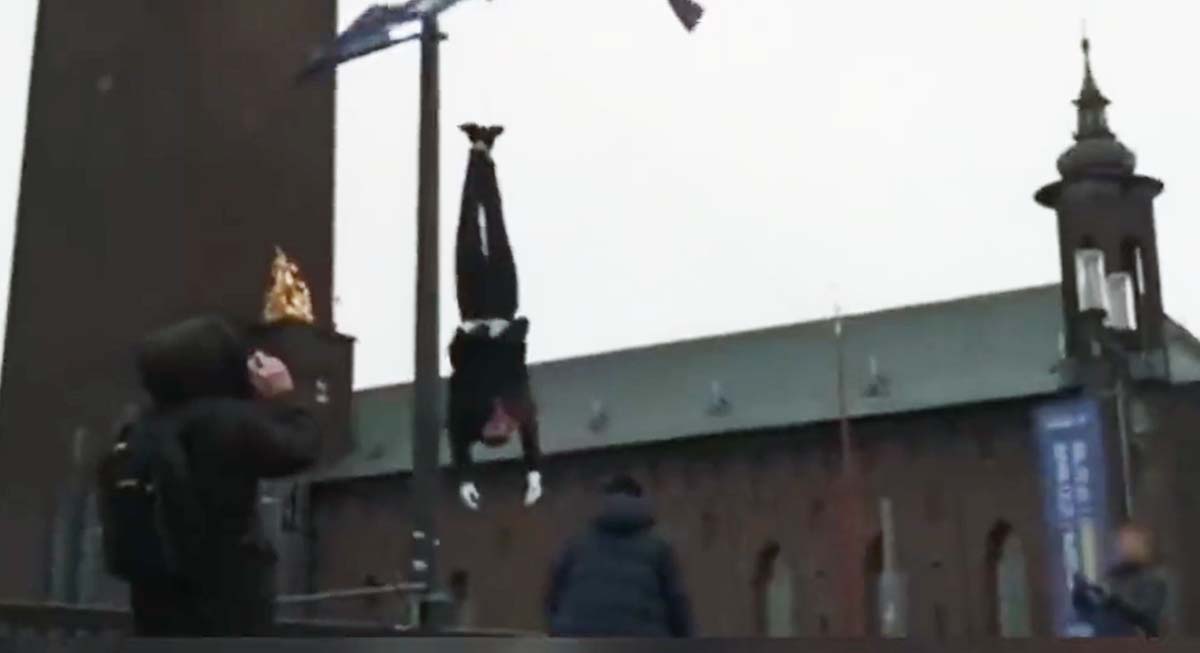 Swedish FM says the portrayal of an executed elected President outside City Hall is deplorable