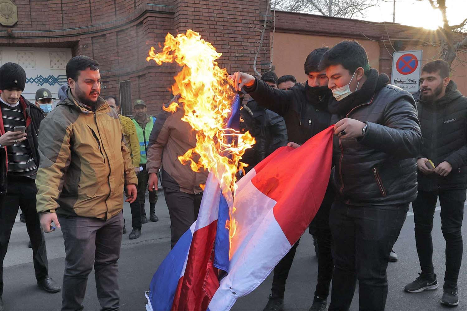 Hundreds of protesters shouted “Death to France”